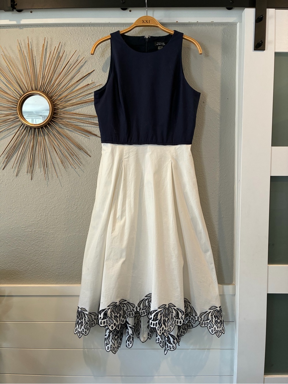 Two-Tone Navy and White Sleeveless Midi Dress with Embroidered Hem